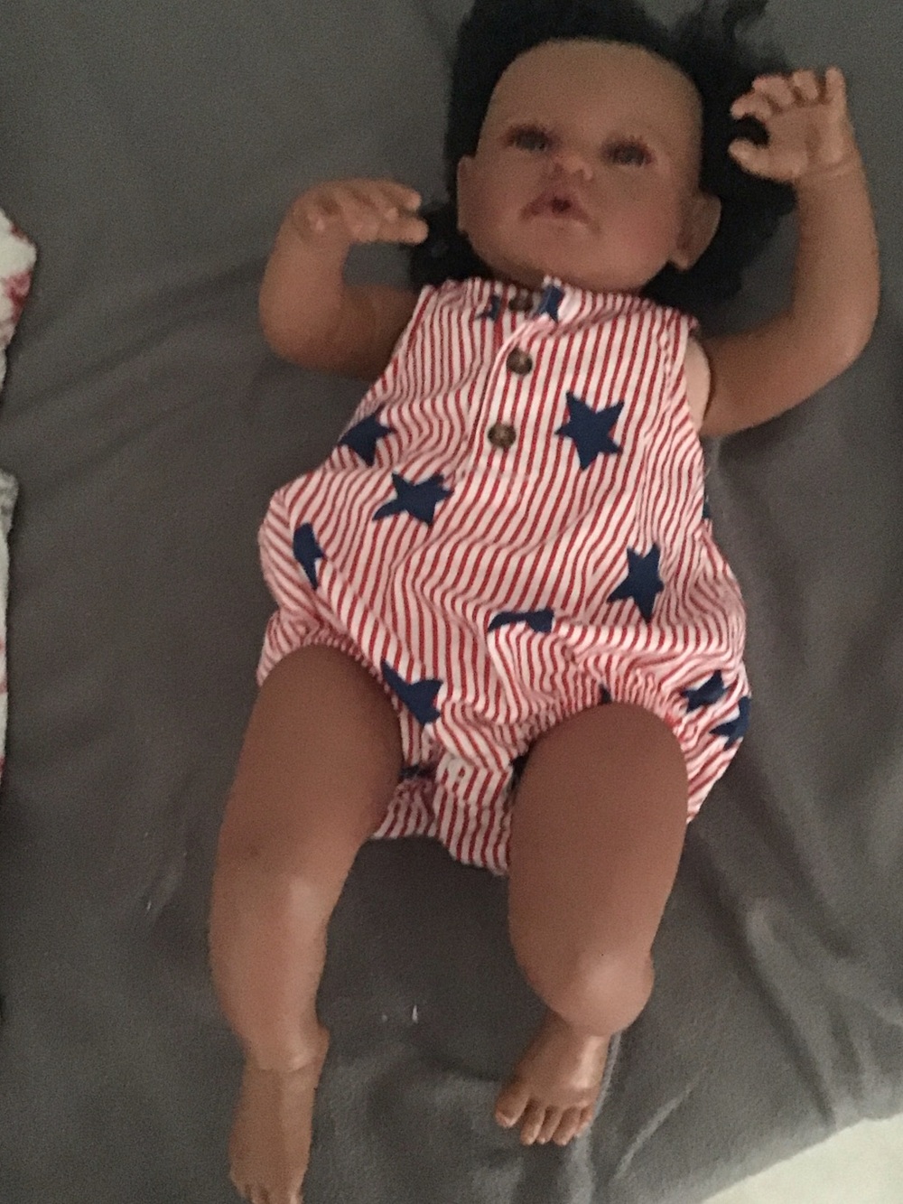 Baby doll with red and blue romper